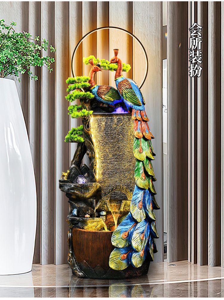 Tiểu cảnh non bộ khô trang trí trong nhà với tượng chim công